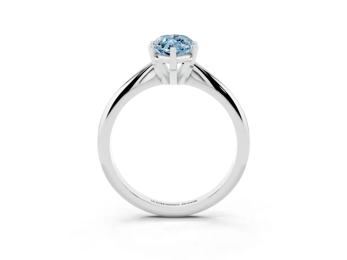Fancy Blue Marquise Cut Cut Solitaire Ring with Four-Prong Setting on a Classic Band Silver