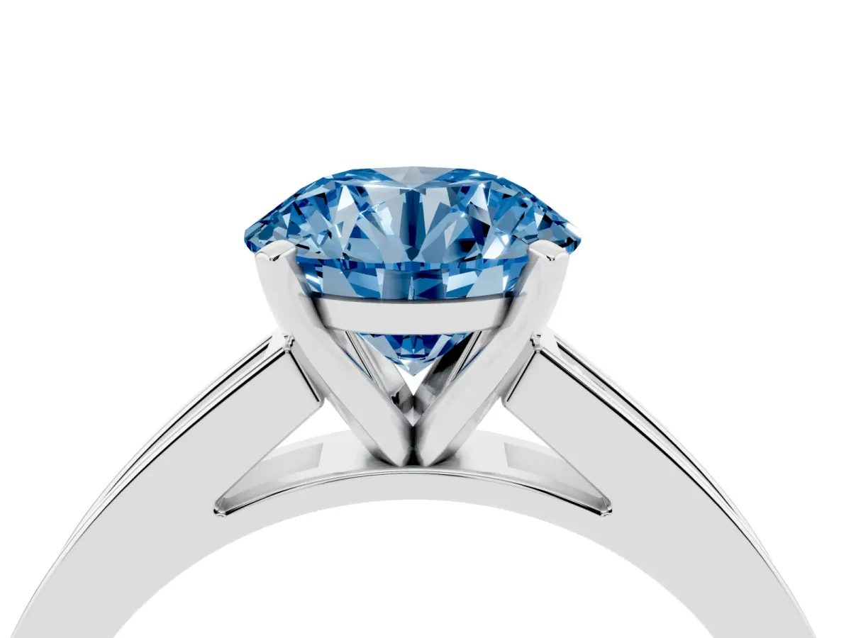 Fancy Blue Round Cut Solitaire Diamond Ring with Channel-Set Band and Four-Prong Setting Platinum