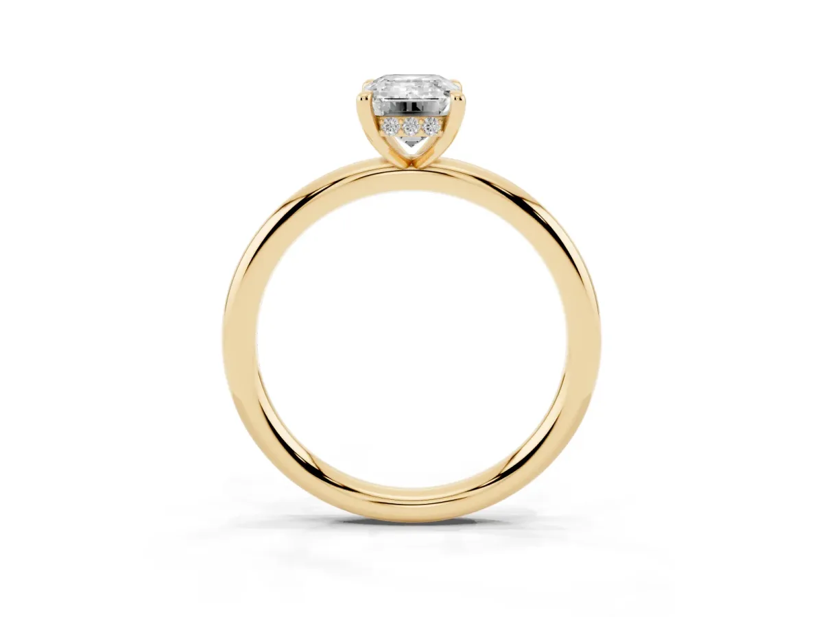 Emerald Cut Diamond Solitaire Ring with Thin Band and Four-Prong Setting Yellow gold