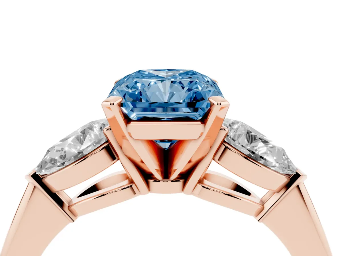 Fancy Blue Three-Stone Radiant Cut Diamond Ring with Pear Side Stones and Four-Prong Setting Rose gold