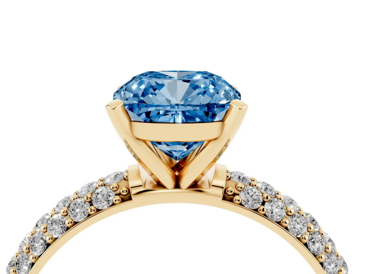 Fancy Blue Cushion Cut Diamond Solitaire Ring with Prong Setting and Pavé Band Yellow gold