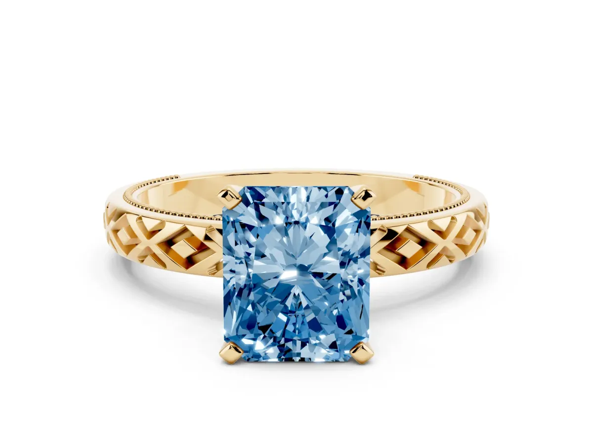 Fancy Blue Radiant Cut Solitaire Diamond Ring with Milgrain and Black Enamel X Pattern Band Yellow gold