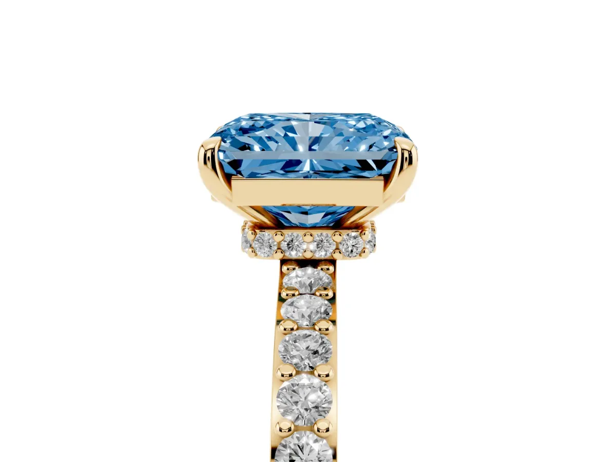 Fancy Blue Radiant Cut Diamond Pavé Engagement Ring with Round Accents and Prong Setting Yellow gold