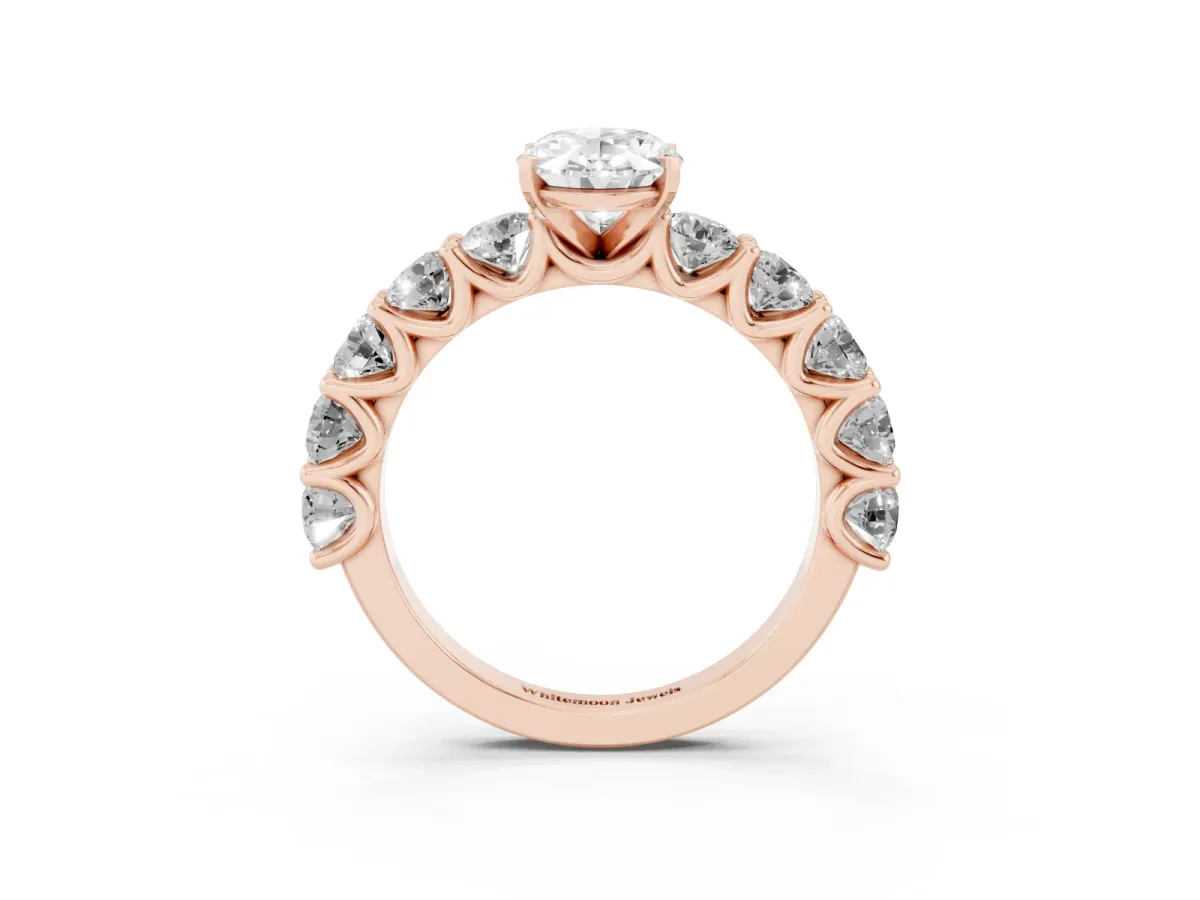 Oval Cut Diamond Prong Setting with Side Stones on a Pave Band Rose gold