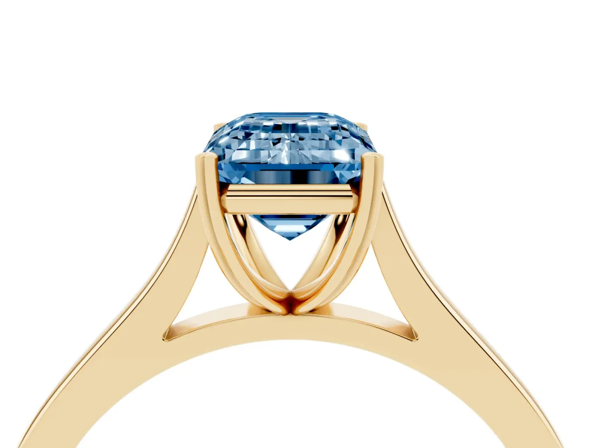 Fancy Blue Emerald Cut Solitaire Heart Prong Engagement Ring with Tapered Band Yellow gold