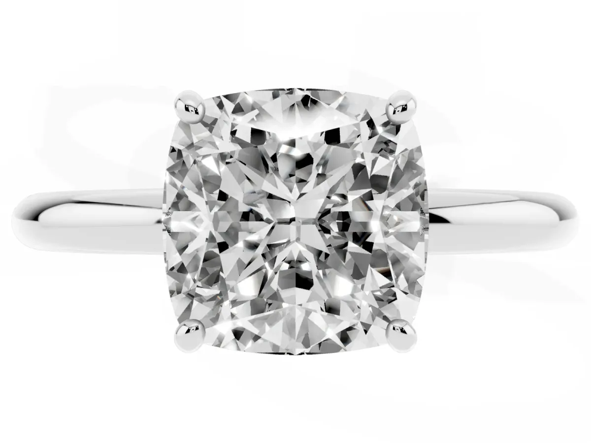 Cushion Cut Solitaire Diamond Ring with Four-Prong Setting on a Plain Band Platinum
