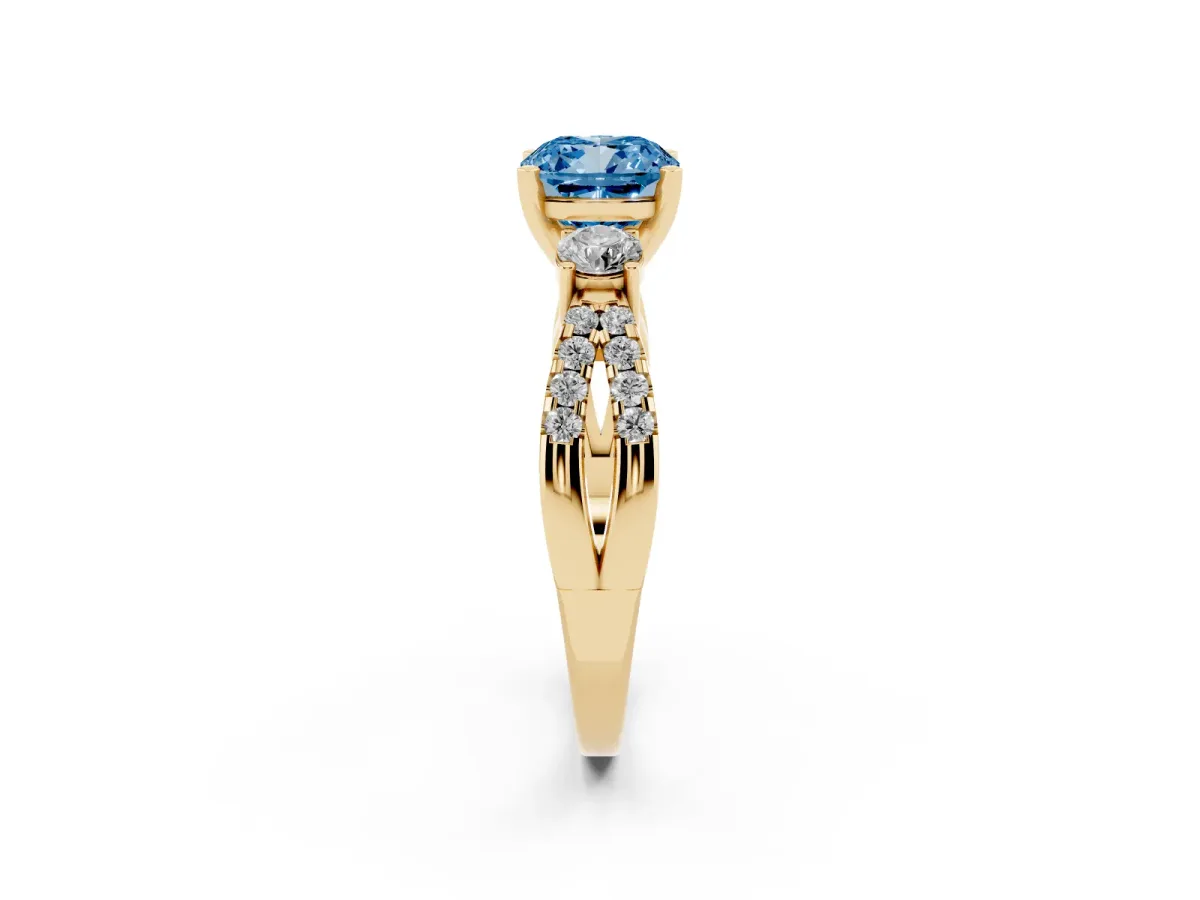 Fancy Blue Cushion Cut Diamond Three-Stone Ring with Pavé Split Shank and Four-Prong Setting Yellow gold