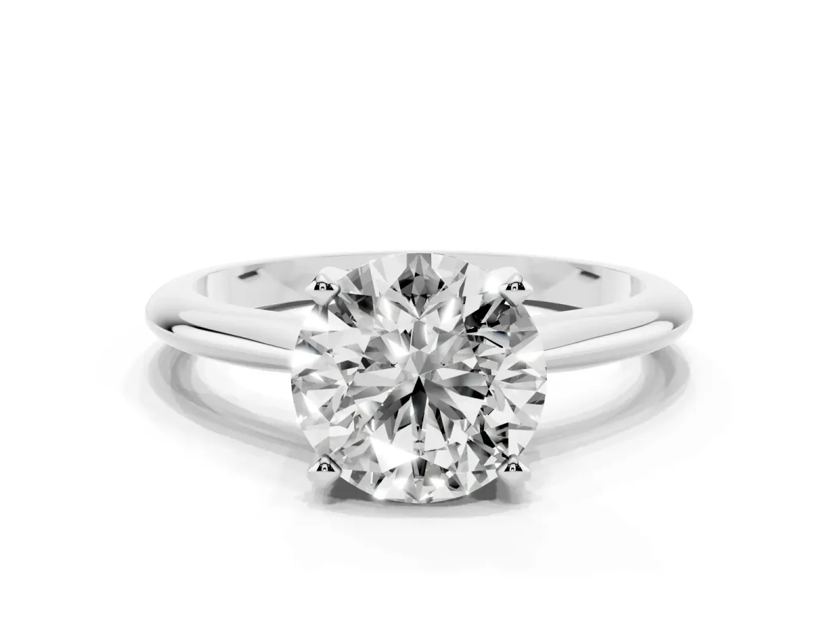 Round Cut Cut Solitaire Ring with Four-Prong Setting on a Classic Band Silver