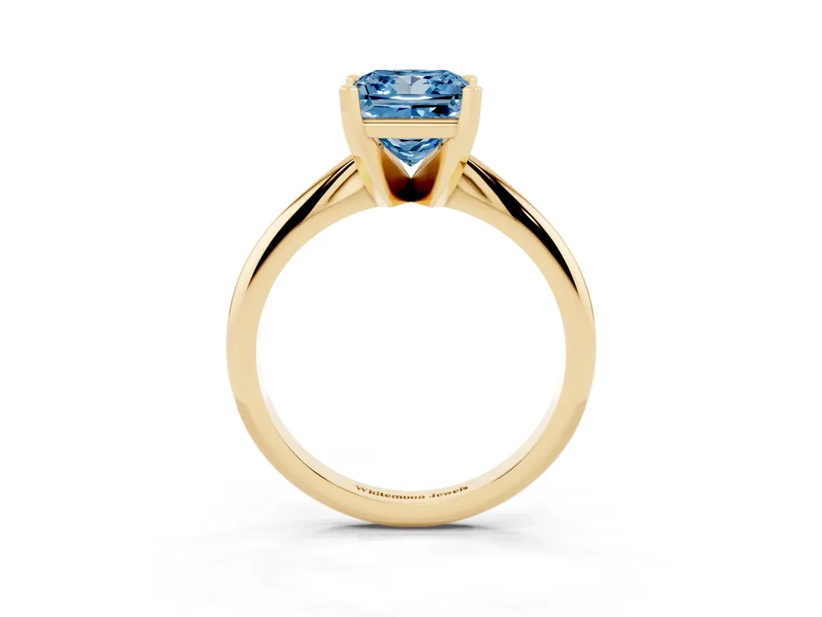 Fancy Blue Princess Cut Cut Solitaire Ring with Four-Prong Setting on a Classic Band Yellow gold