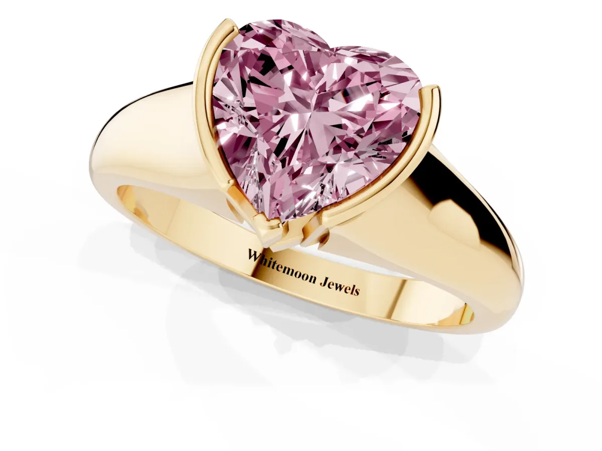 Fancy Pink Heart Cut Solitaire Tension Set Diamond Ring with Split Shank Band Yellow gold