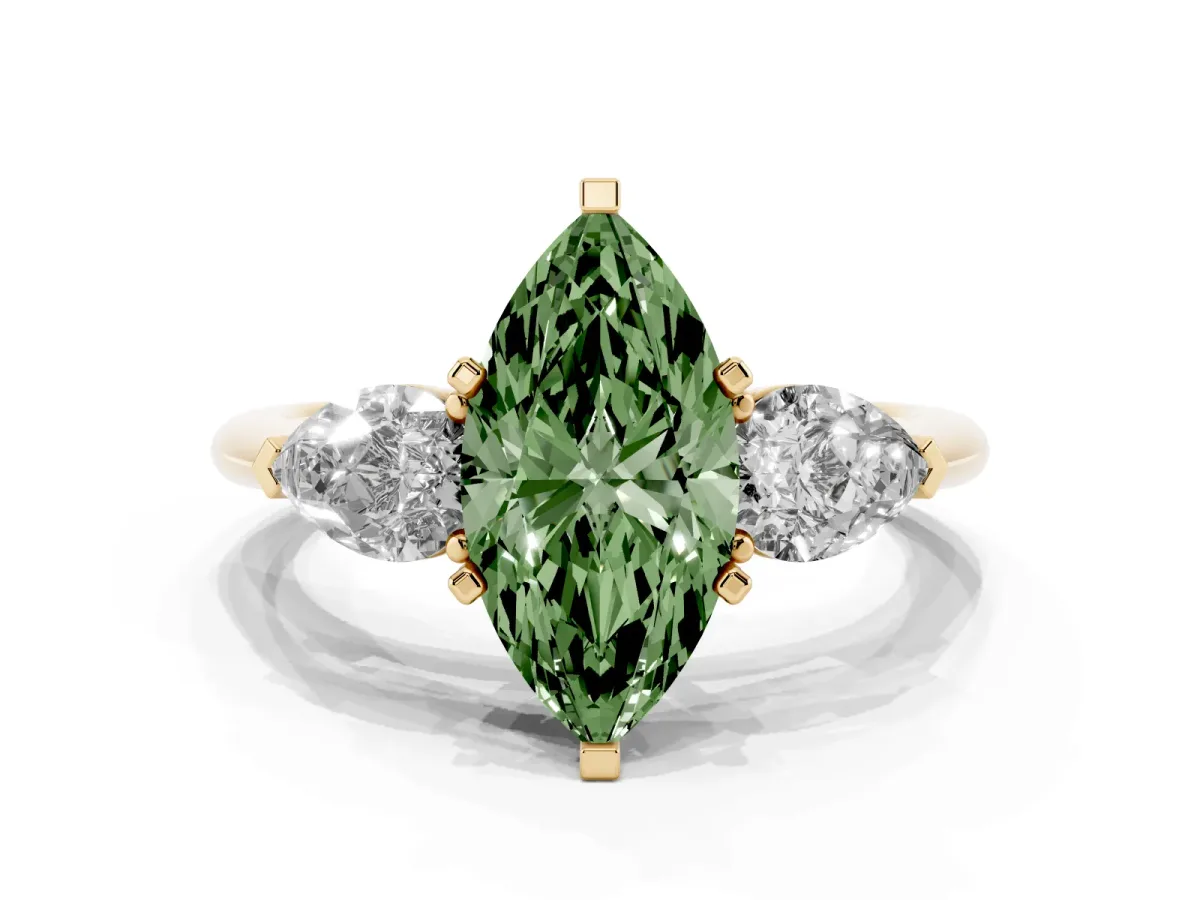 Fancy Green Three-Stone Marquise Cut Diamond Ring with Pear Side Stones and Four-Prong Setting Yellow gold