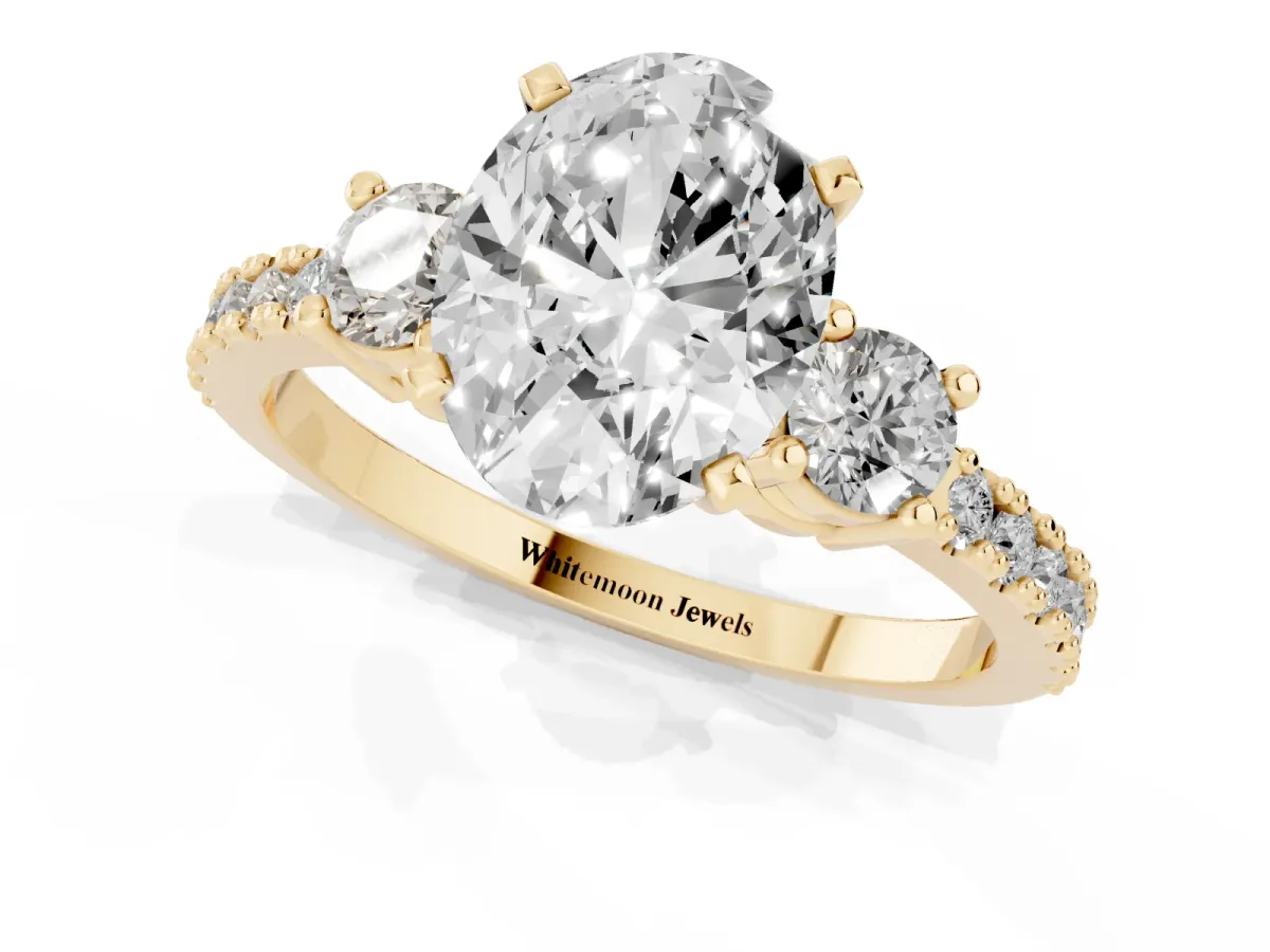 Oval Cut Three-Stone Diamond Pavé Band with Prong Setting Yellow gold