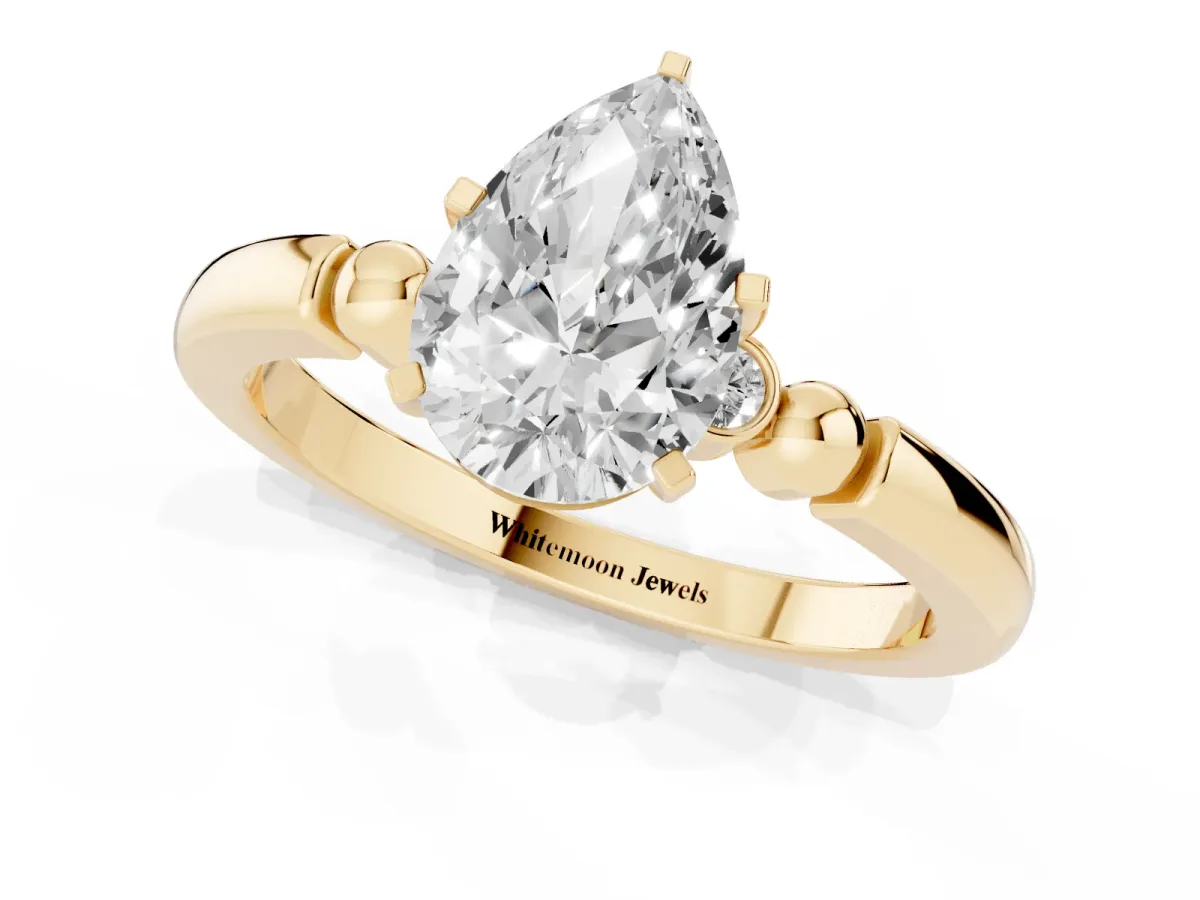 Pear Cut Solitaire Beaded Band with Four-Prong Setting Yellow gold