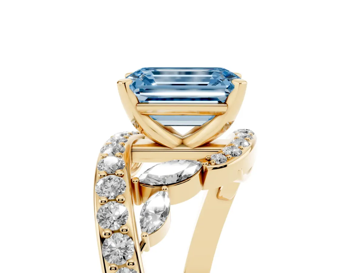 Fancy Blue Emerald Cut Solitaire with Pavé Twist Band and Four-Prong Setting Yellow gold