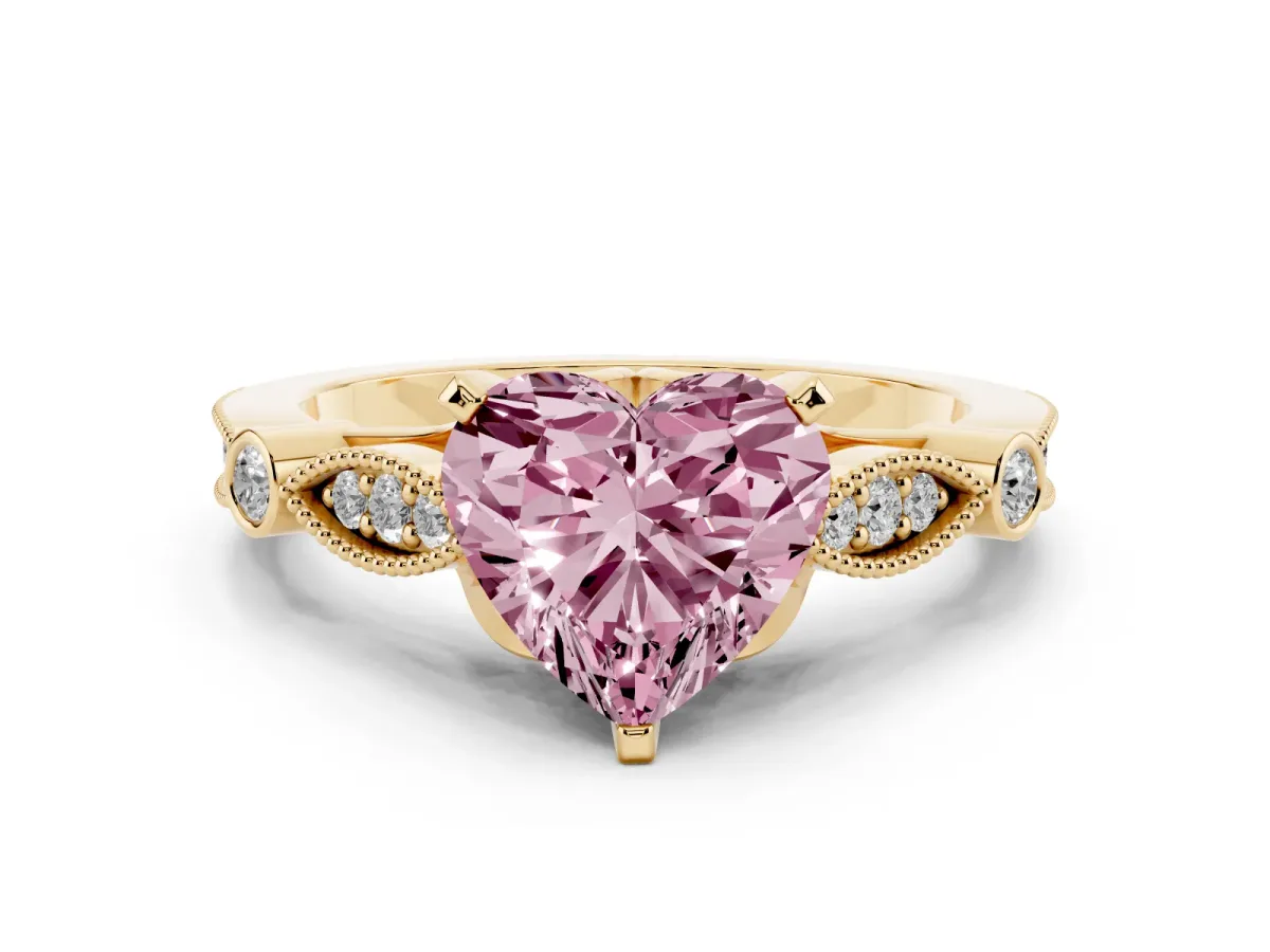 Fancy Pink Heart Cut Cut Diamond with Milgrain Marquise and Bezel Accents on a Solitaire Band with Prong Setting Yellow gold