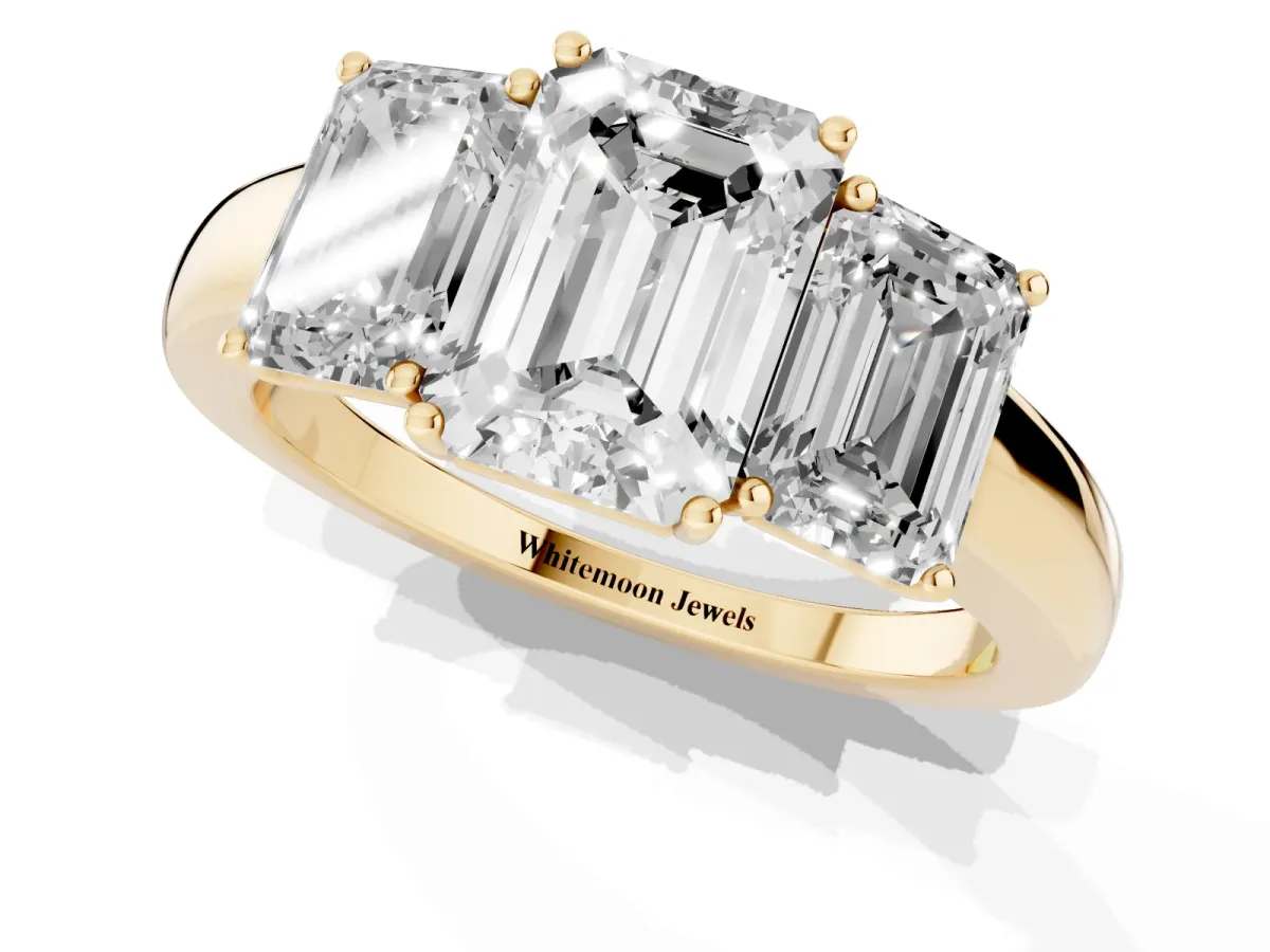 Emerald Cut Diamond Three-Stone Ring with Four-Prong Setting and Classic Band Yellow gold