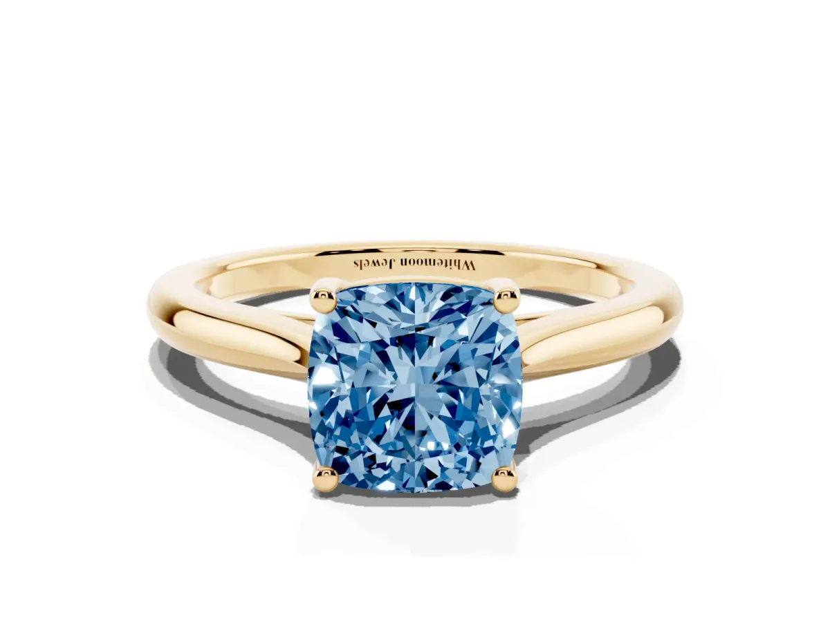 Fancy Blue Cushion Cut Cut Solitaire Ring with Cathedral Band and Four-Prong Setting Yellow gold