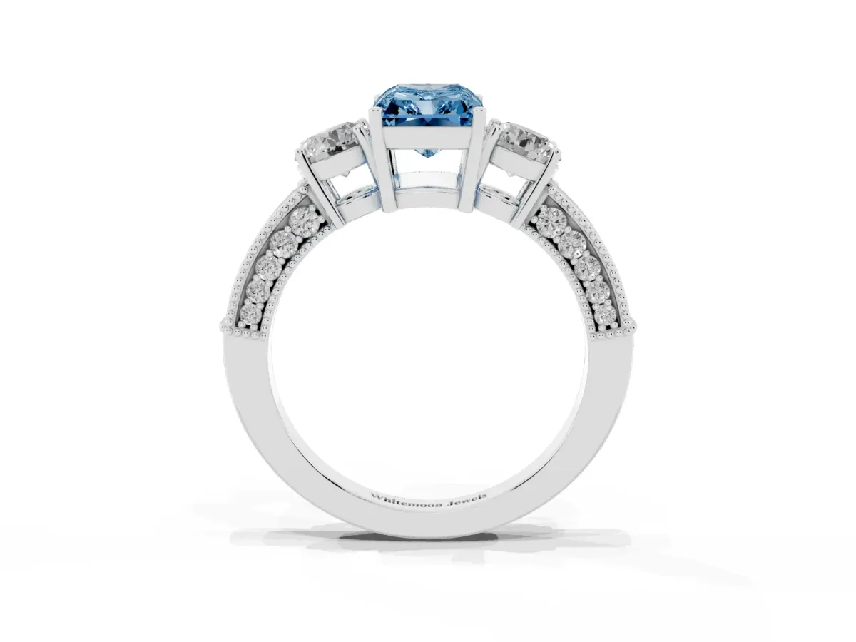 Fancy Blue Radiant Cut Three-Stone Diamond Ring with Pavé Band and Four-Prong Setting Silver