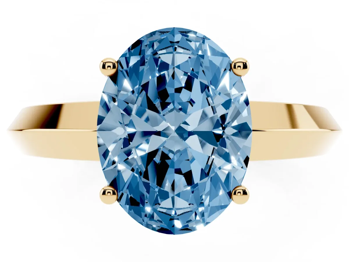 Fancy Blue Oval Cut Cut Solitaire Engagement Ring with Flat Band and Four-Prong Setting Yellow gold