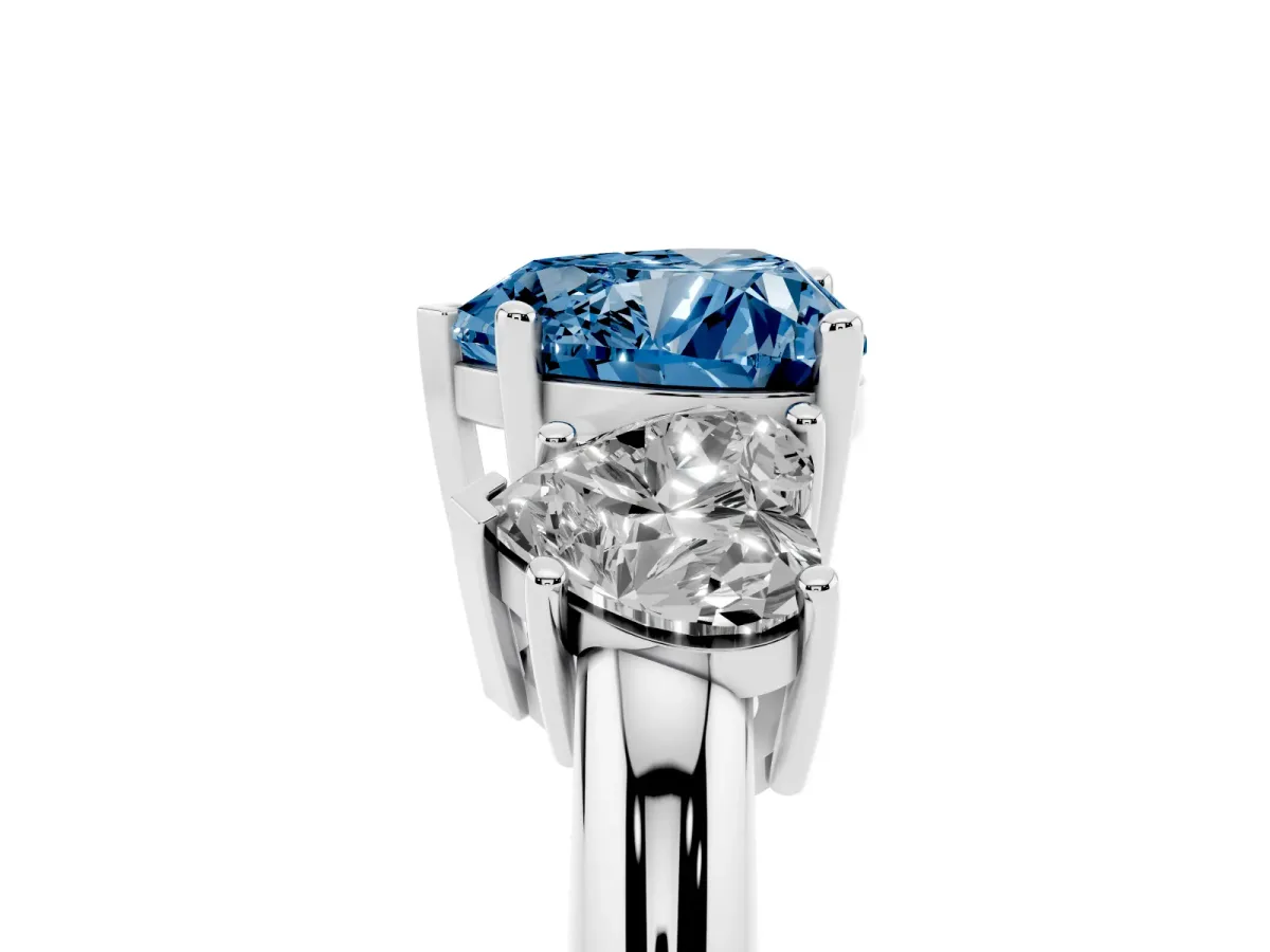 Fancy Blue Three-Stone Heart Cut Cut Diamond Engagement Ring with Prong Setting on a White Gold Band Platinum