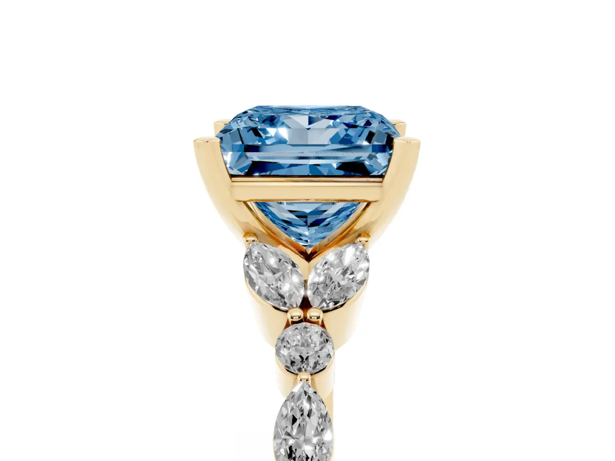 Fancy Blue Princess Cut Diamond Solitaire Ring with Side Stones and Four-Prong Setting Yellow gold