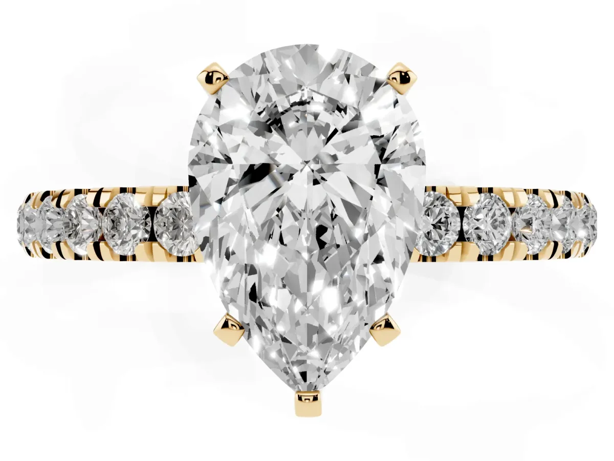 Pear Cut Diamond Solitaire Ring with Pavé Accents and Four-Prong Setting Yellow gold