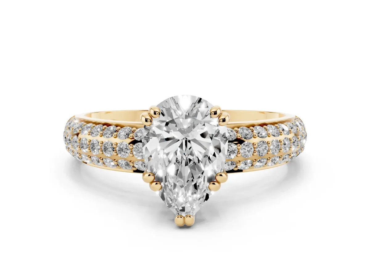 Pear Cut Diamond Solitaire Ring with Multi-Row Round Pavé Band and Prong Setting Yellow gold