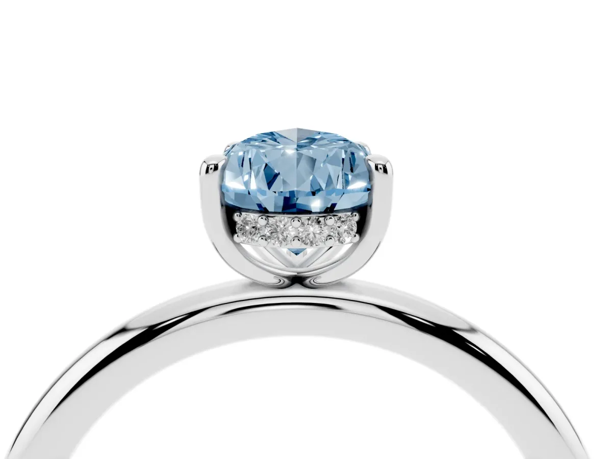 Fancy Blue Pear Cut Diamond Solitaire Ring with Thin Band and Four-Prong Setting Silver