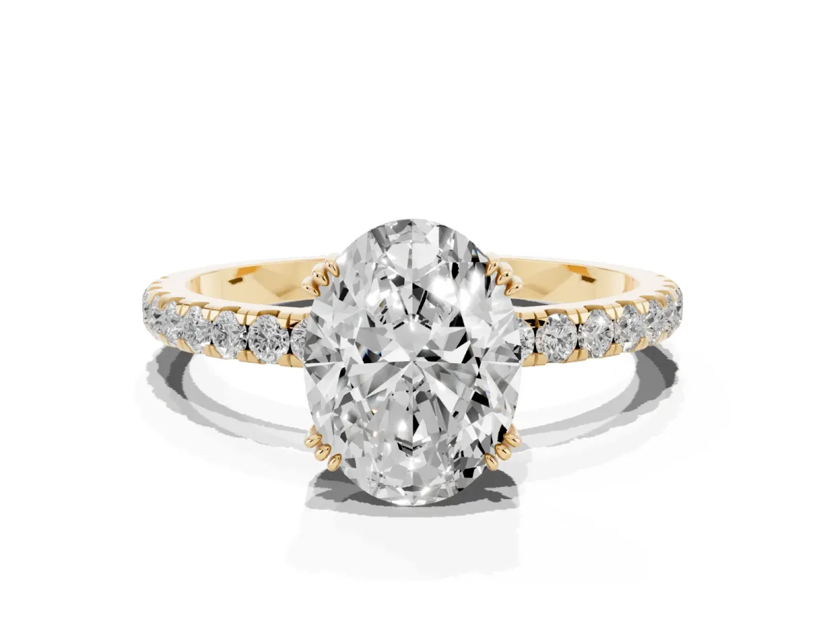 Oval Cut Brilliant Solitaire with Pavé Band and Claw Prong Setting Yellow gold