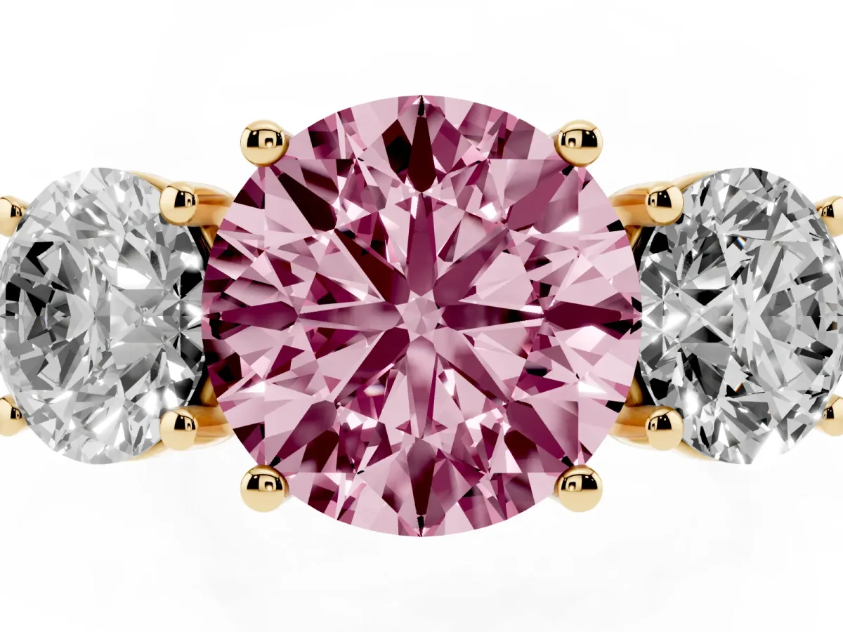 Fancy Pink Three-Stone Round Cut Diamond Ring with Round Pavé Band and Prong Setting Yellow gold