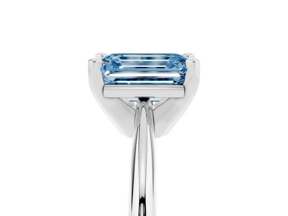 Fancy Blue Emerald Cut Cut Solitaire Ring with Four-Prong Setting on a Classic Band White gold