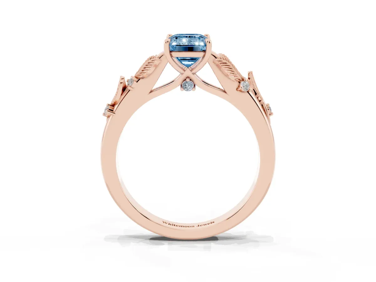 Fancy Blue Emerald Cut Diamond Solitaire Ring with Leaf Motif Band and Four-Prong Setting Rose gold