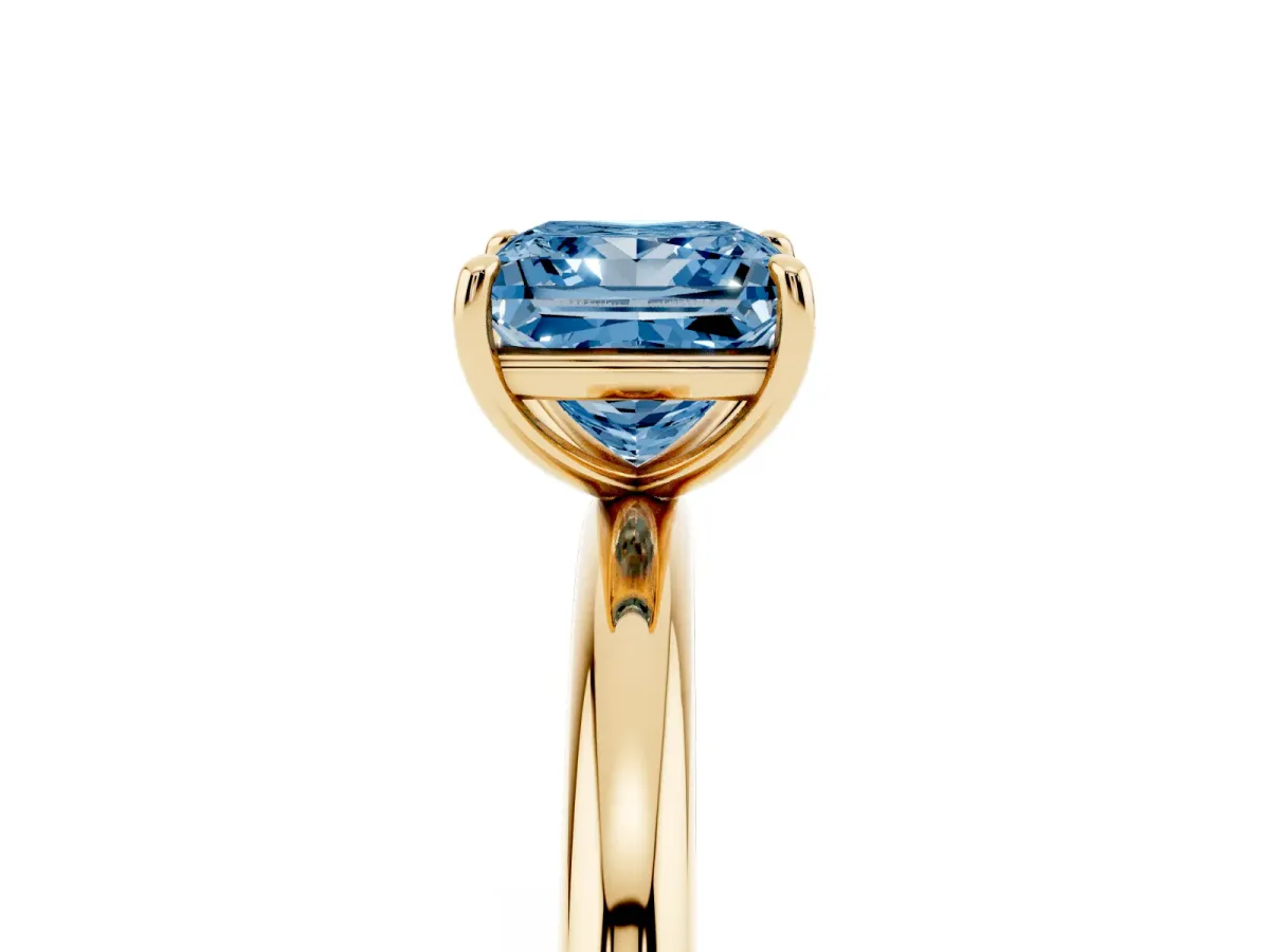 Fancy Blue Princess Cut Solitaire Diamond Ring with Four-Prong Setting on a Plain Band Yellow gold
