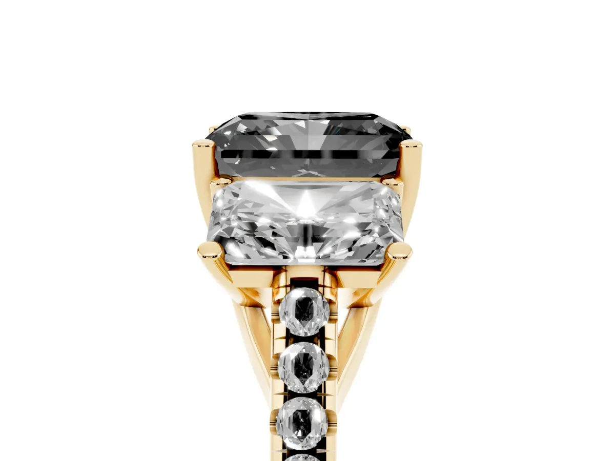 Fancy Black Three-Stone Radiant Cut Diamond Ring with Round Pavé Band and Prong Setting Yellow gold