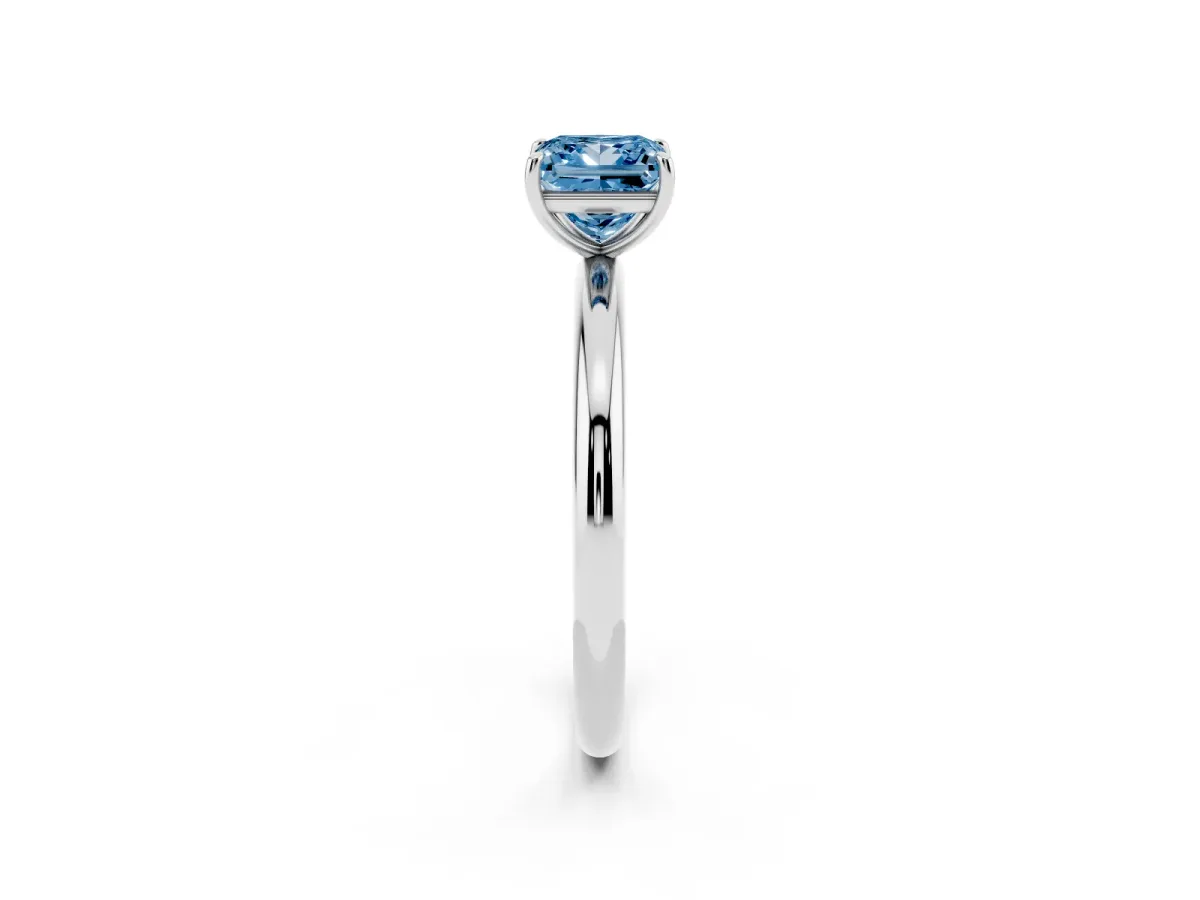 Fancy Blue Princess Cut Solitaire Diamond Ring with Four-Prong Setting on a Plain Band Platinum