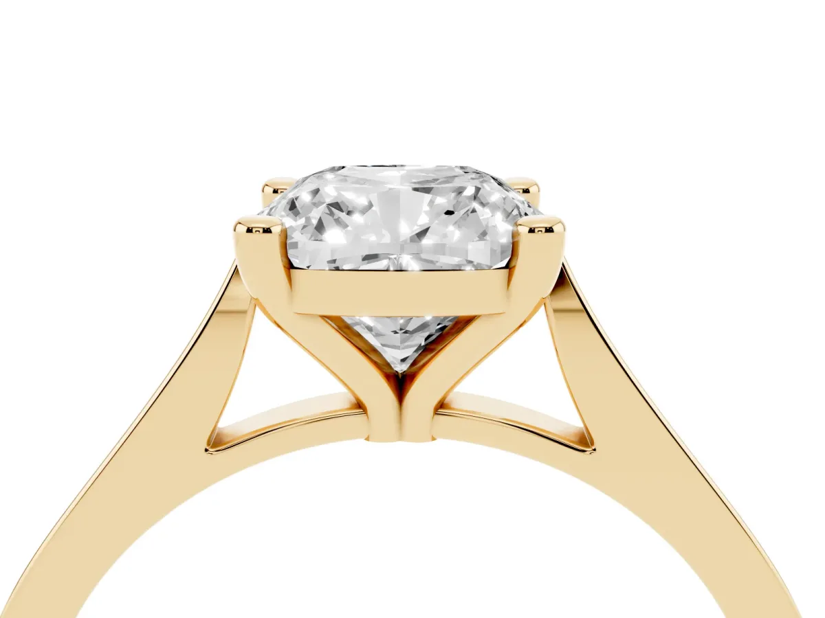 Cushion Cut Solitaire Diamond Ring with Four-Prong Setting and Tapered Band Yellow gold