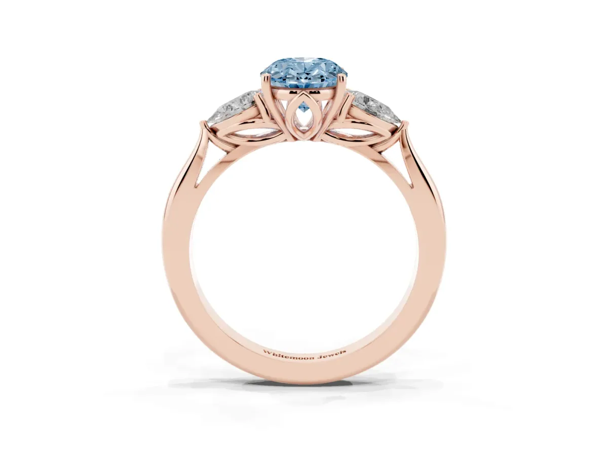 Fancy Blue Three-Stone Oval Cut Brilliant Diamond Solitaire Ring with Tapered Band and Four-Prong Setting Rose gold