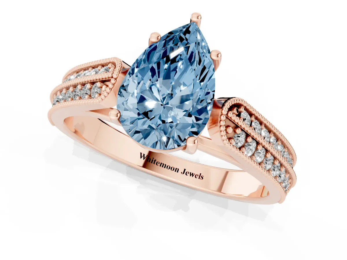 Fancy Blue Pear Cut Cut Pave Split Shank Engagement Ring with Four-Prong Setting Rose gold