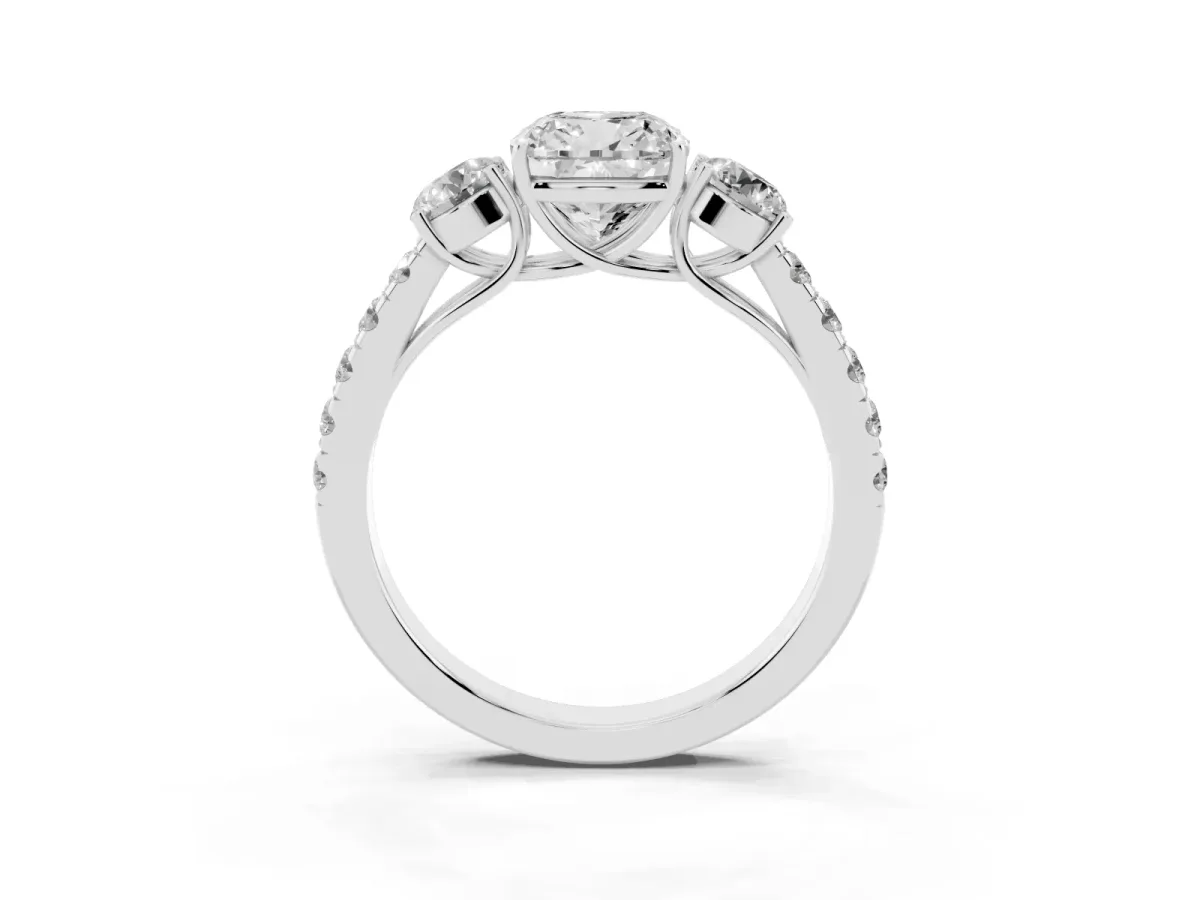 Cushion Cut Cut Diamond Three-Stone Ring with Round Side Stones and Pavé Band Platinum