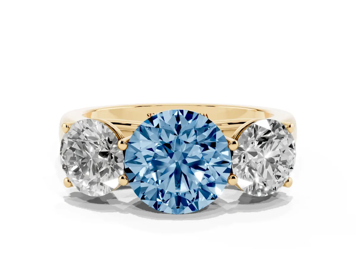 Fancy Blue Round Cut Three-Stone Diamond Ring with Prong Setting on a Classic Band Yellow gold
