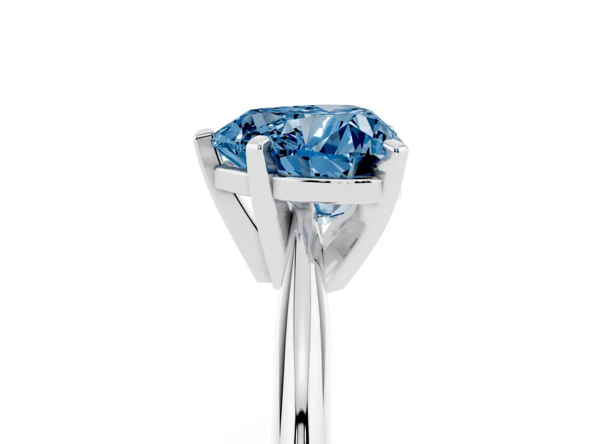Fancy Blue Heart Cut Cut Solitaire Ring with Four-Prong Setting on a Classic Band Silver