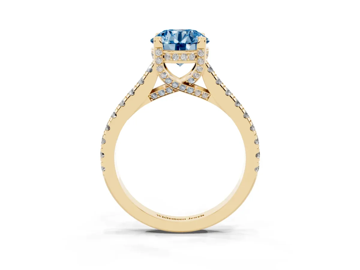 Fancy Blue Round Cut Brilliant Diamond Solitaire with Pavé Band and Four-Prong Setting Yellow gold
