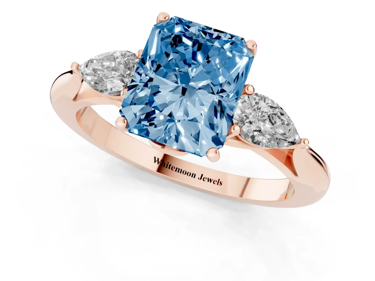 Fancy Blue Three-Stone Radiant Cut Brilliant Diamond Solitaire Ring with Tapered Band and Four-Prong Setting Rose gold