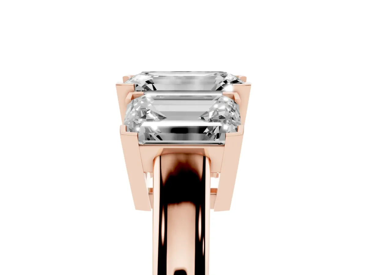 Three-Stone Emerald Cut Cut Diamond Ring with Channel Set Band and Four-Prong Setting Rose gold