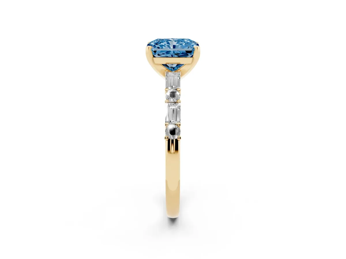 Fancy Blue Radiant Cut Diamond Solitaire with Side Baguettes and Channel Set Band Yellow gold