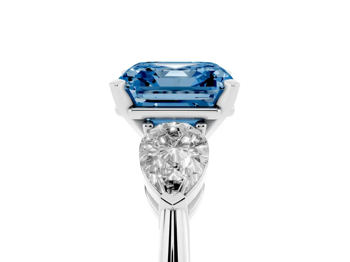 Fancy Blue Three-Stone Asscher Cut Diamond Ring with Pear Side Stones and Four-Prong Setting Platinum