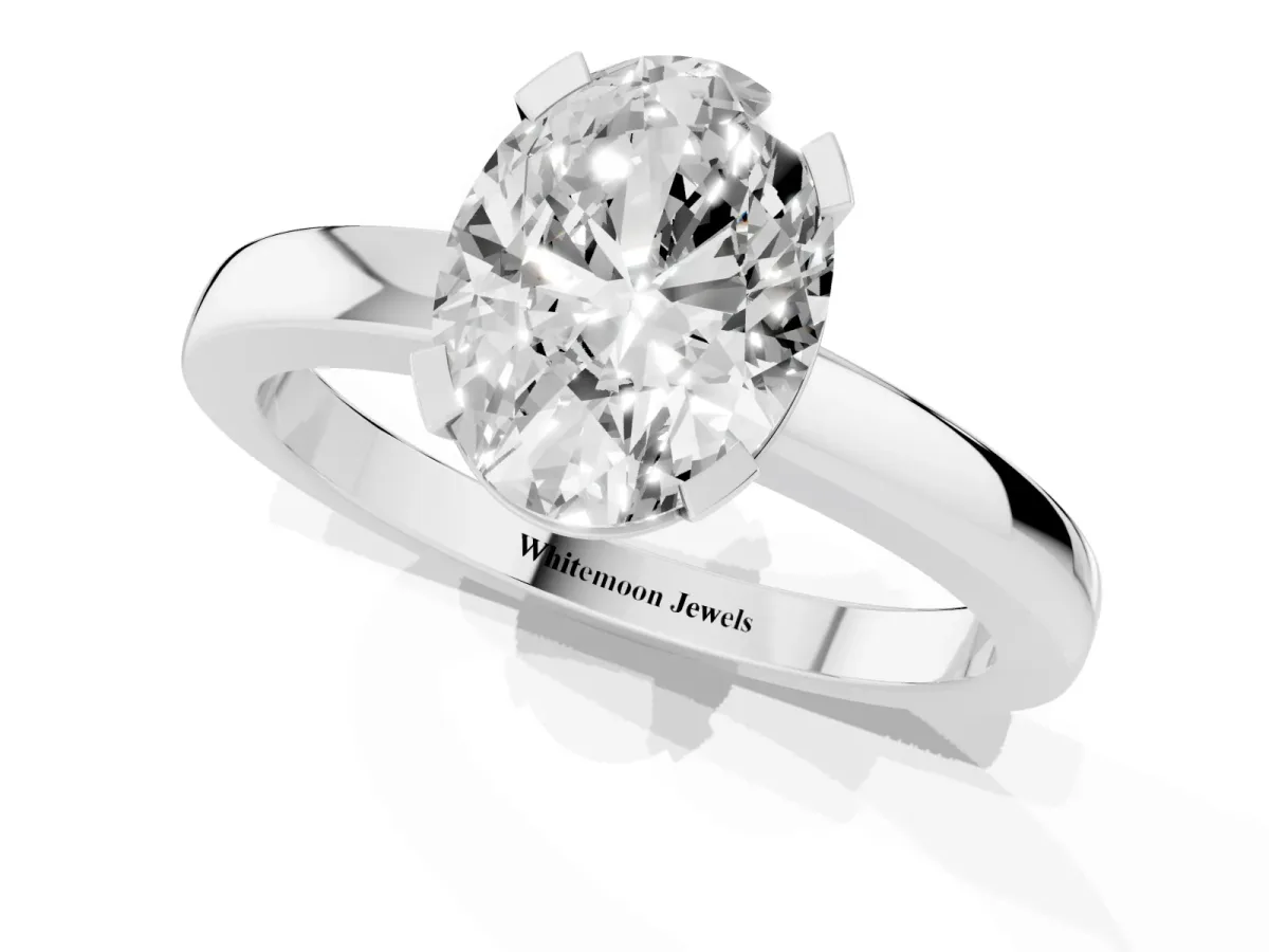 Oval Cut Cut Solitaire Ring with Four-Prong Setting and Classic Band Silver