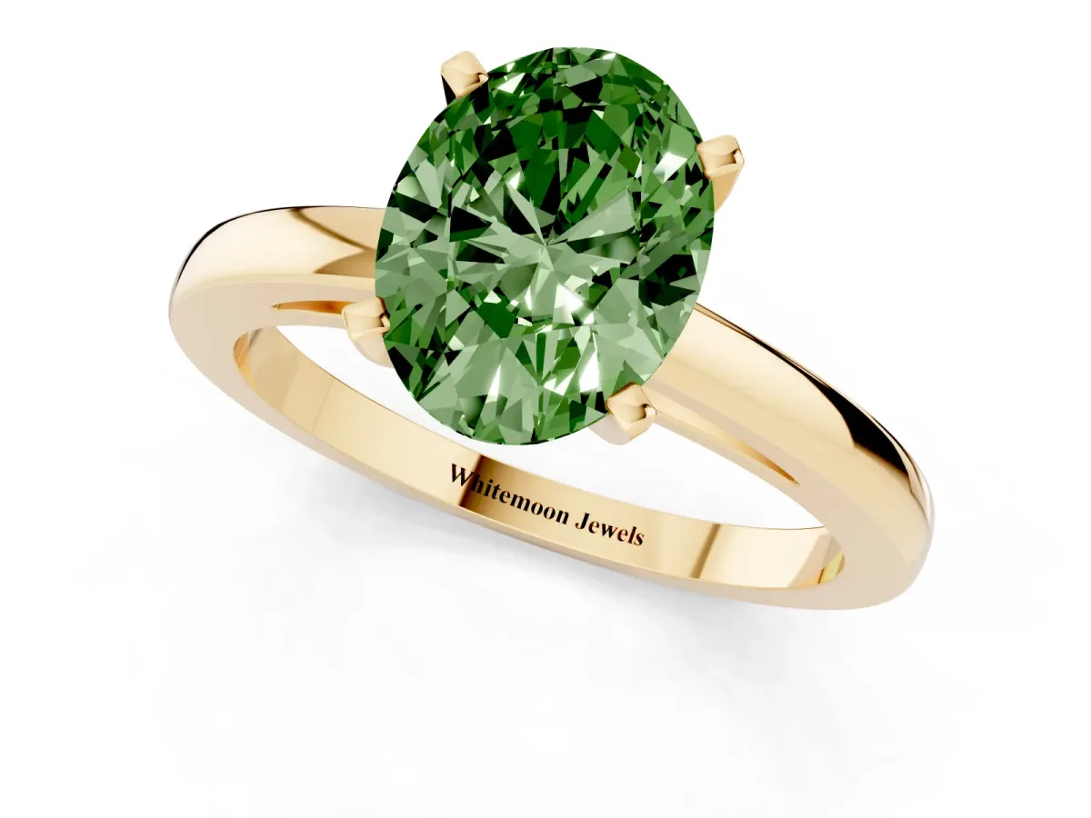 Fancy Green Oval Cut Solitaire Diamond Engagement Ring with Four-Prong Setting on a Classic Band Yellow gold
