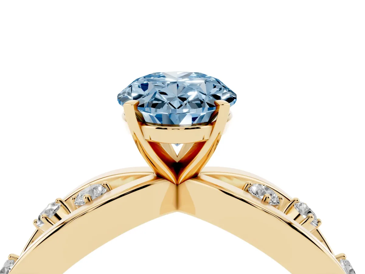 Fancy Blue Oval Cut Cut Solitaire Diamond with Side Stones on Criss-Cross Band and Four-Prong Setting Yellow gold