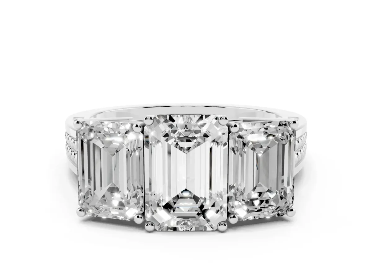 Emerald Cut Diamond Three-Stone Ring with Prong Setting and Textured Band White gold